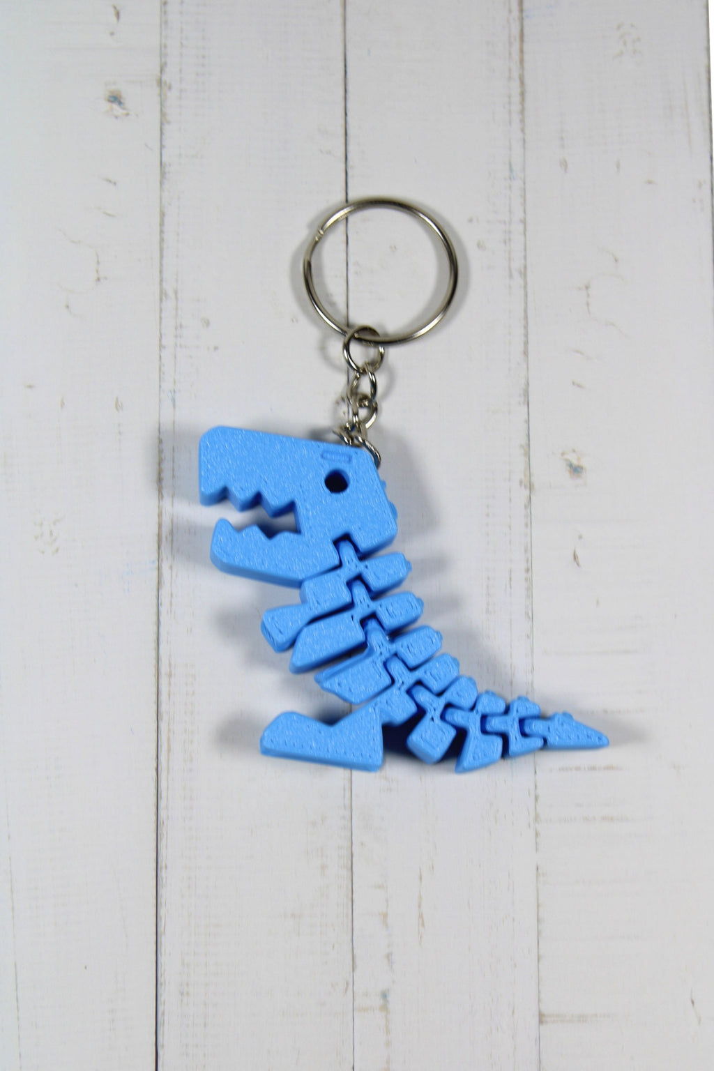bleu.jpg
Porte-clé dinosaure articulé flexible bleu imprimé en 3D