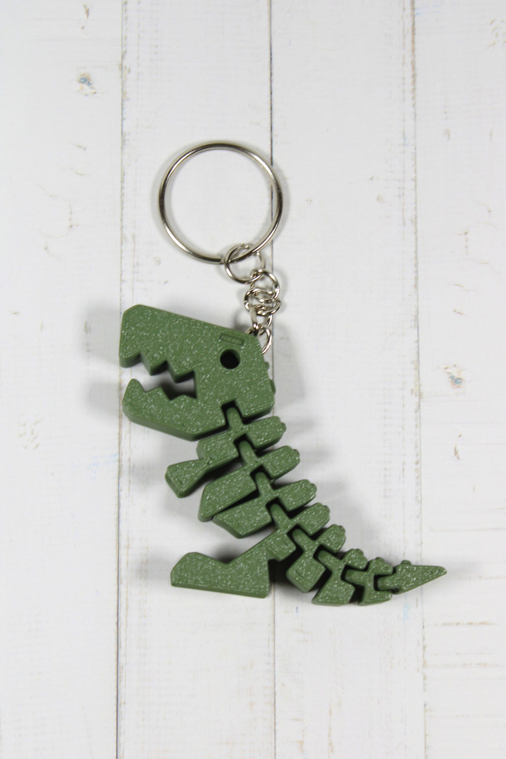 Porte-clé dinosaure articulé flexible vert imprimé en 3D