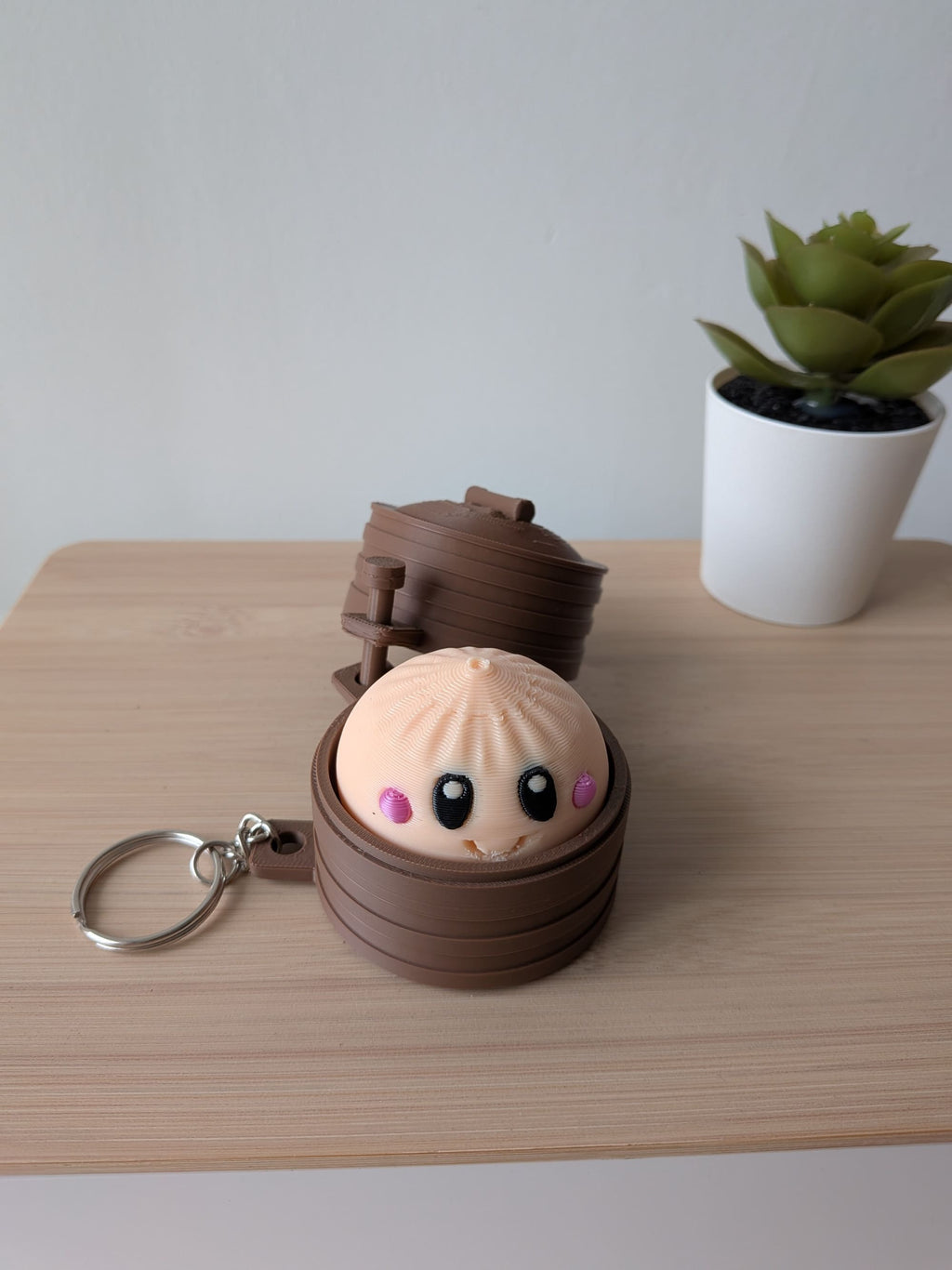 Porte-clés anti-stress kawaii avec personnage et clicker dans sa boîte