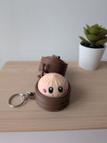 Porte-clés anti-stress kawaii avec personnage et clicker dans sa boîte